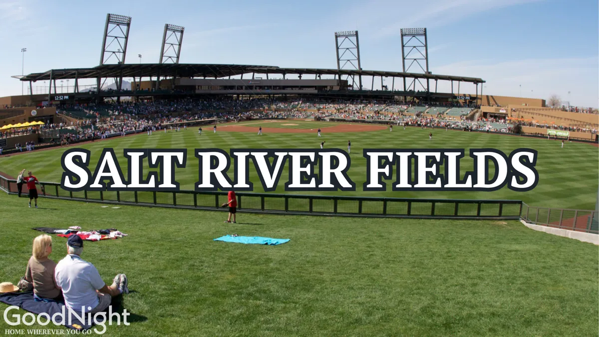 A lively baseball field bustling with players on the field and a joyful audience in the seating area. The sunlit scene highlights the social energy and community spirit of events at Salt River Fields.
